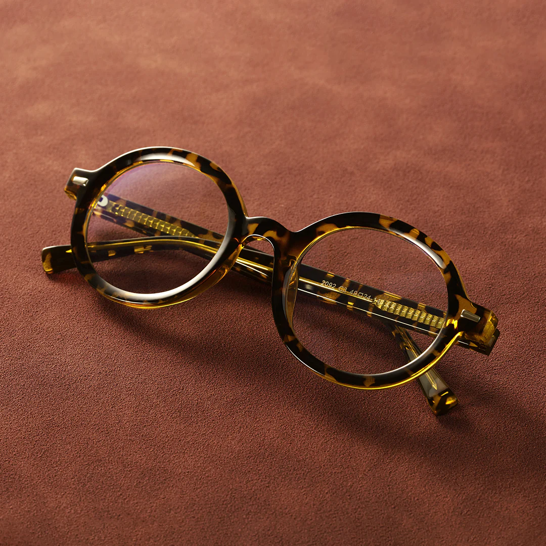 Scene close-up view of Btul round tr90 eyeglasses RR0332302 in brown tortoise