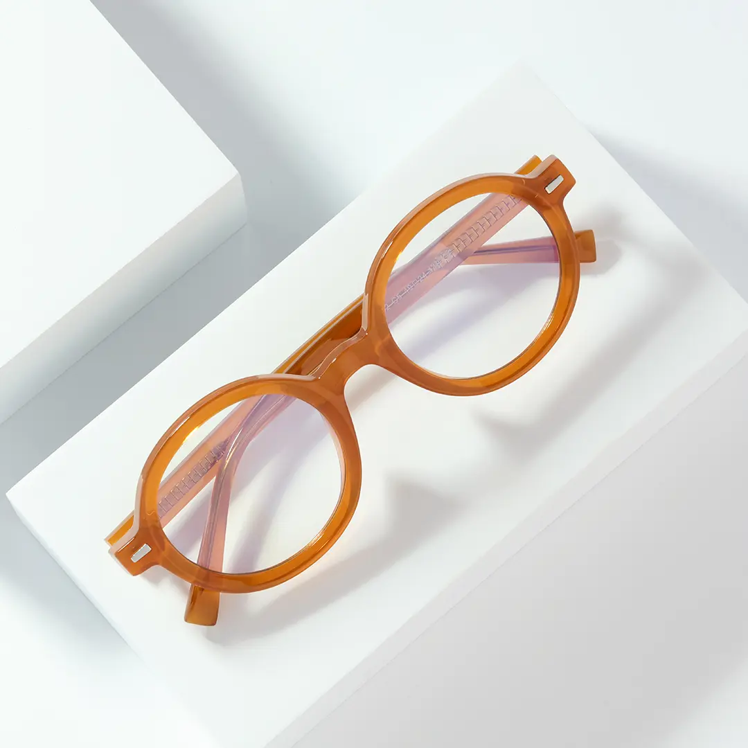 Scene close-up view of Btul round tr90 eyeglasses RR0332302 in orange