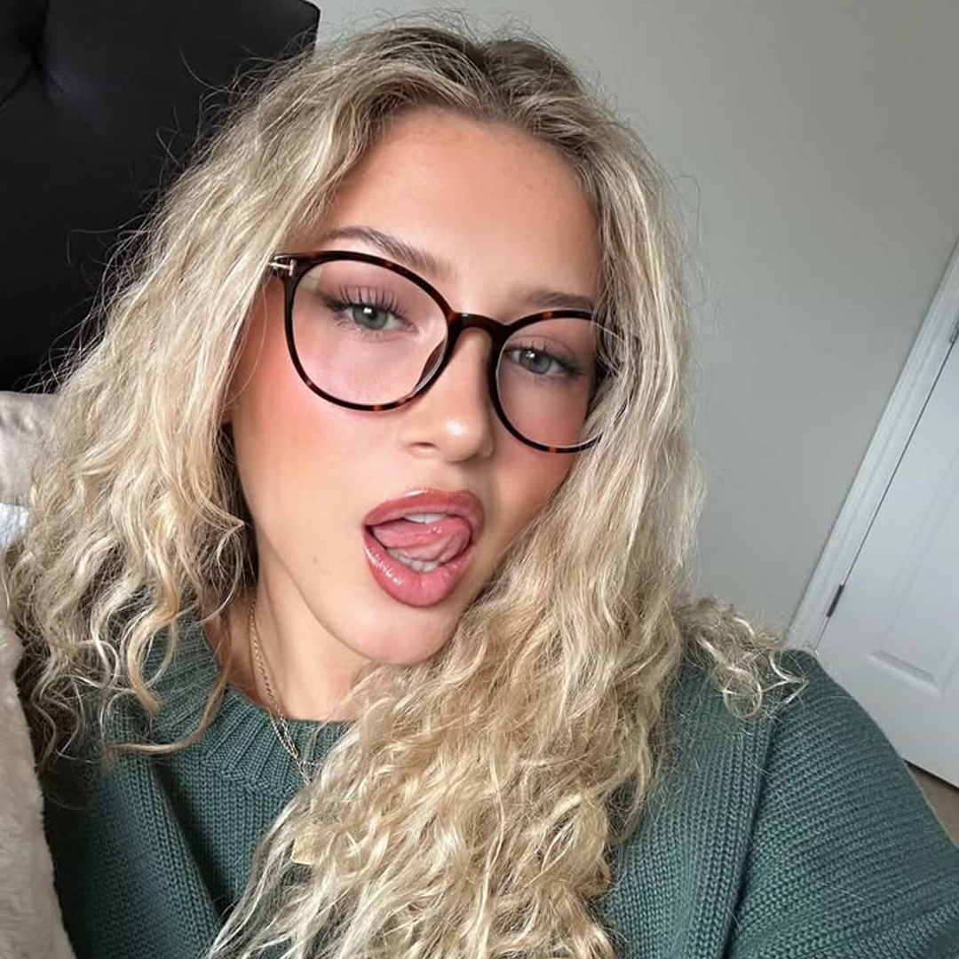 Slightly angled view of female wearing tortoise round eyeglasses, sticking out tongue, various expressions, RR0352506