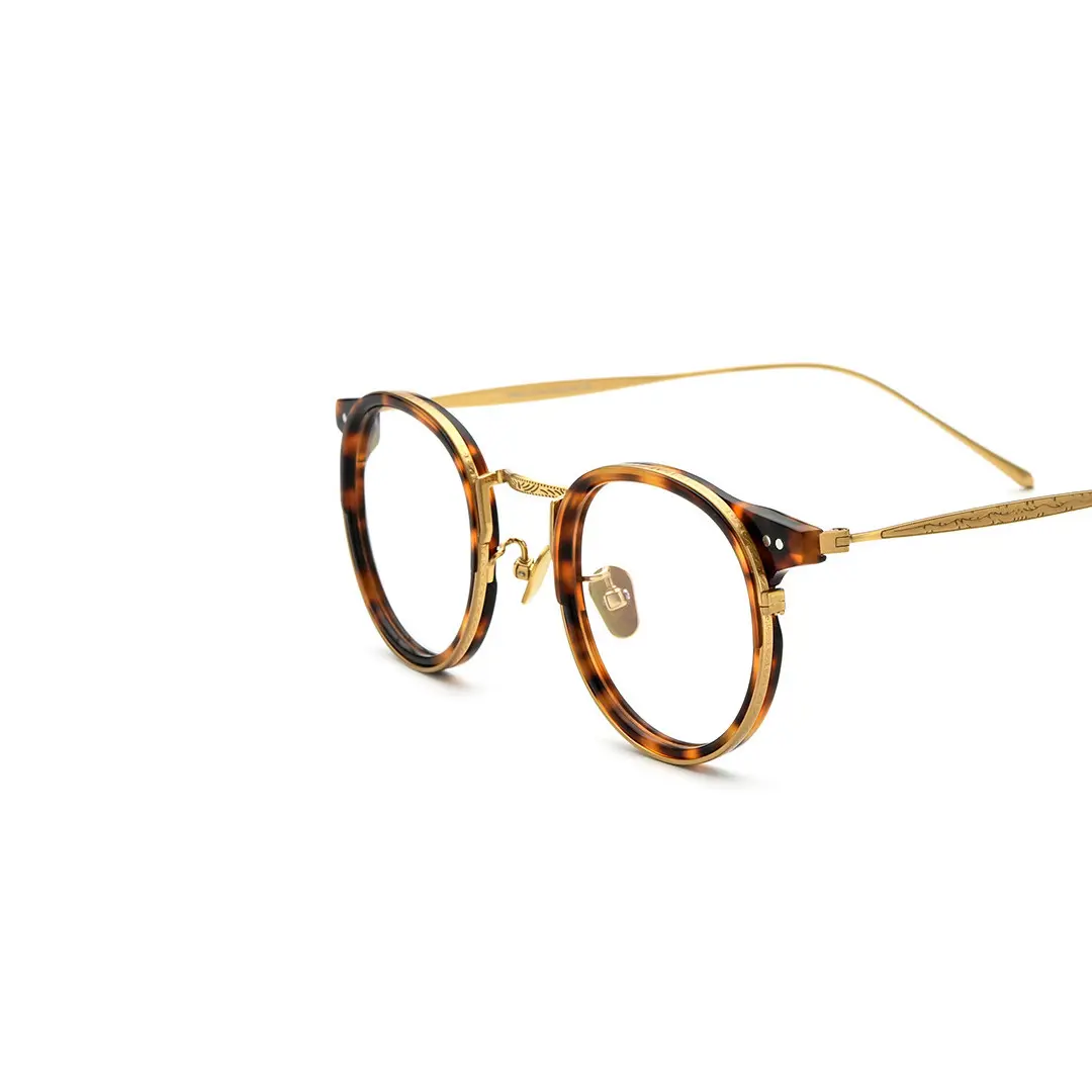 Frame detail view of Felone vintage round titanium eyeglasses RT0022209 in yellow tortoise
