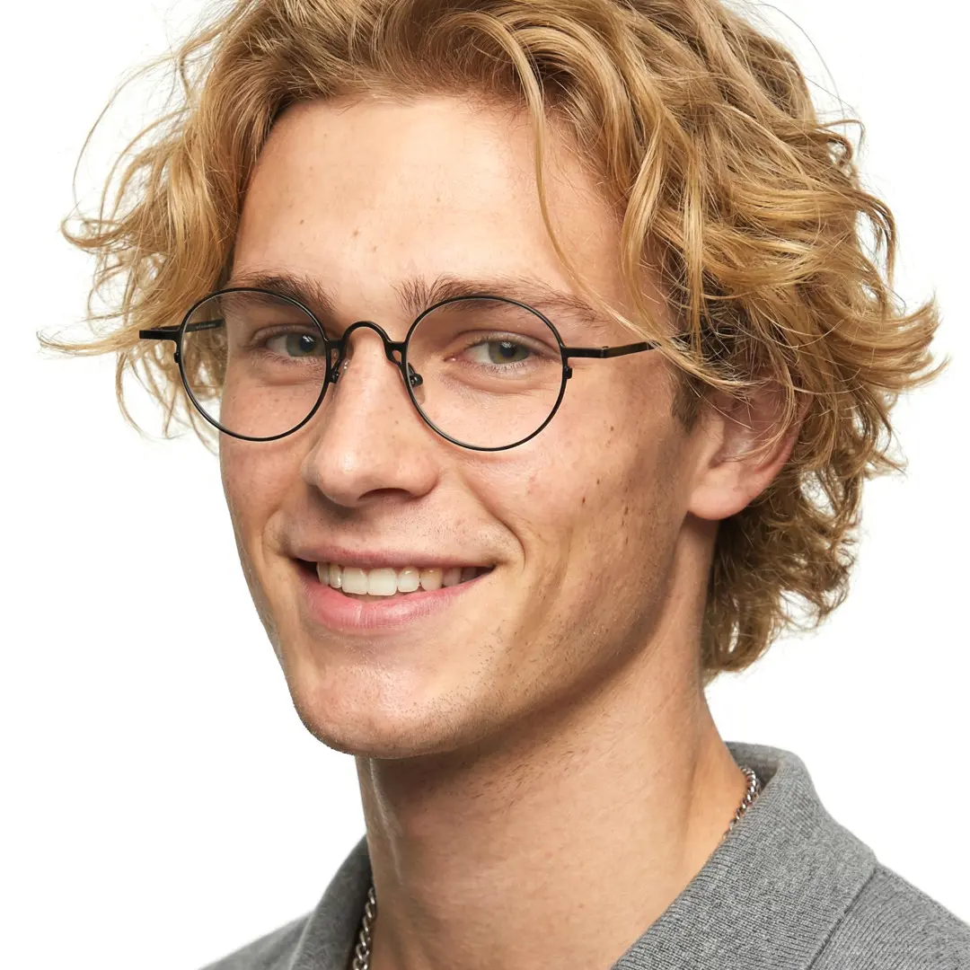 Three-quarter view of male wearing john lennon black round eyeglasses, natural smile, RT0042305