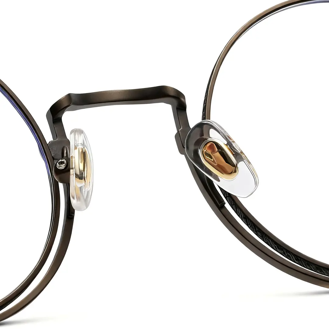 Adjustable nose pad detail of Bour steampunk round titanium eyeglasses in bronze. SPU: RT0052304