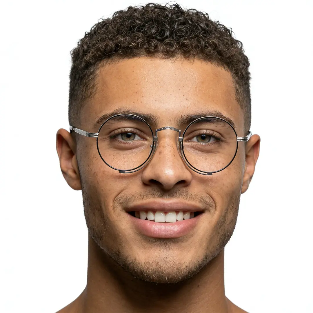 Male wearing steampunk grey round titanium eyeglasses, smiling. SPU: RT0052304