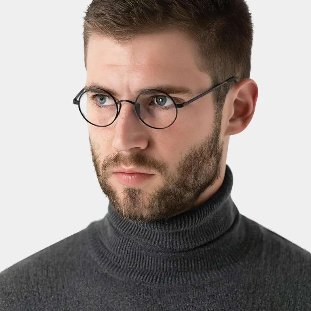 Profile view of male wearing black round eyeglasses, relaxed expression, RT0172303