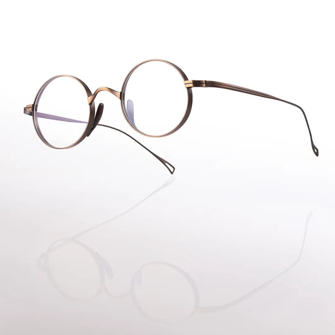 Scene close-up view of Bify round titanium eyeglasses RT0172303 in brown