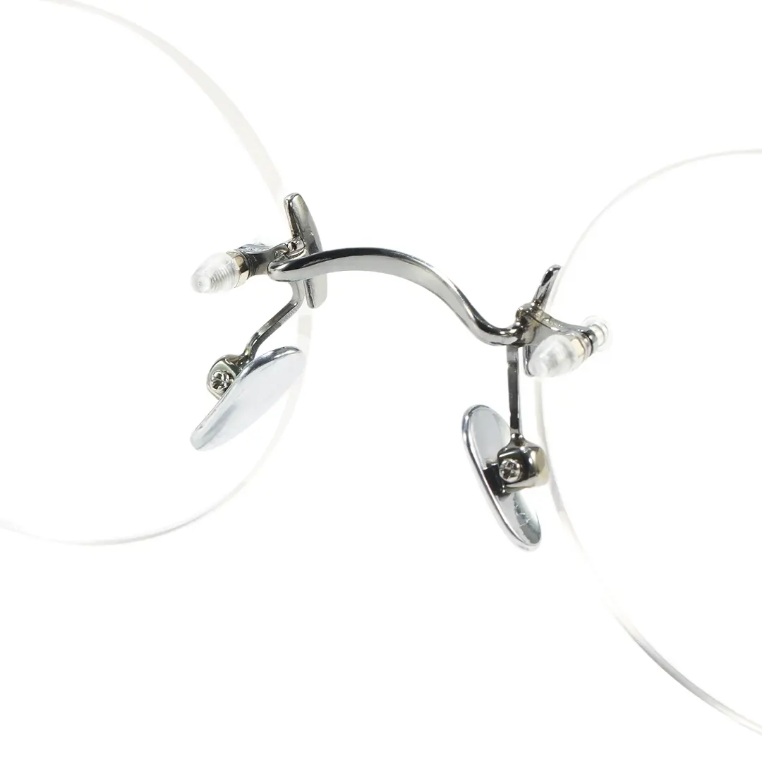 Adjustable nose pad detail of Jyn john lennon round titanium eyeglasses in silver. SPU: RT0262604