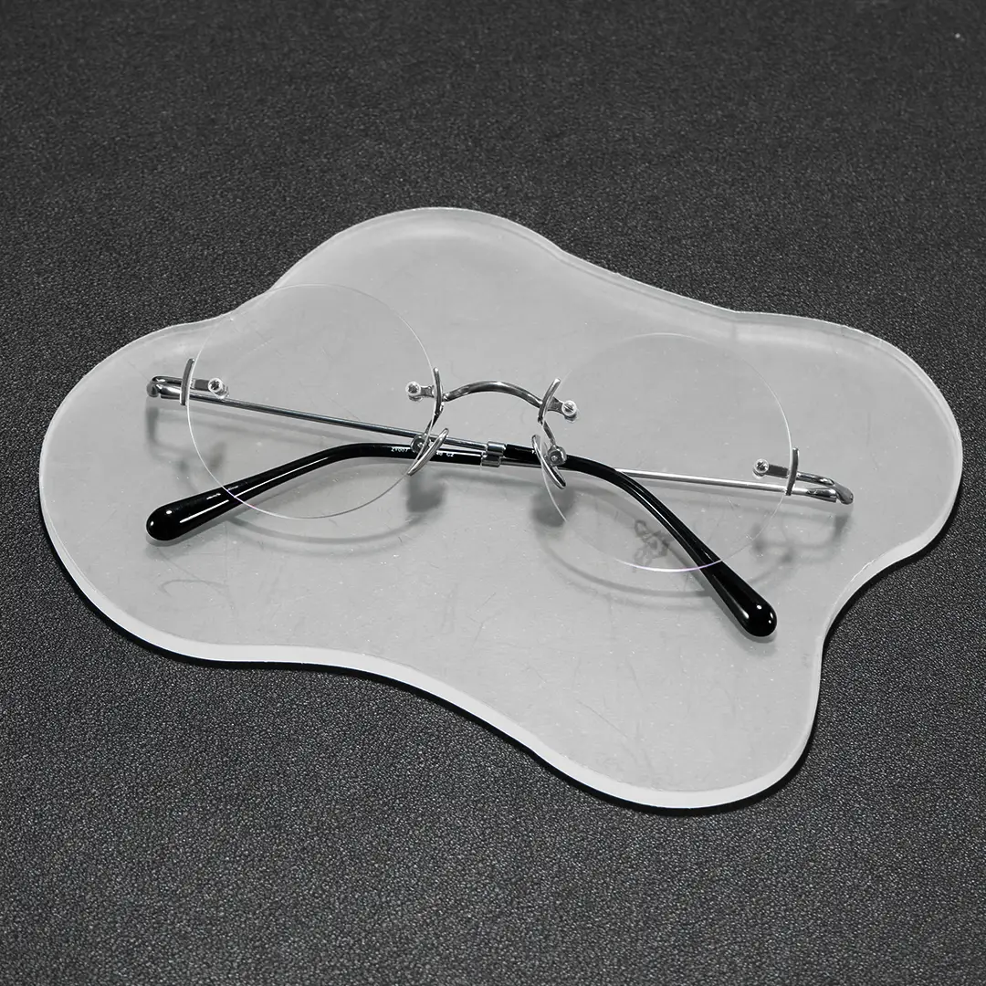 Scene close-up view of Jyn john lennon round titanium eyeglasses in silver. SPU: RT0262604