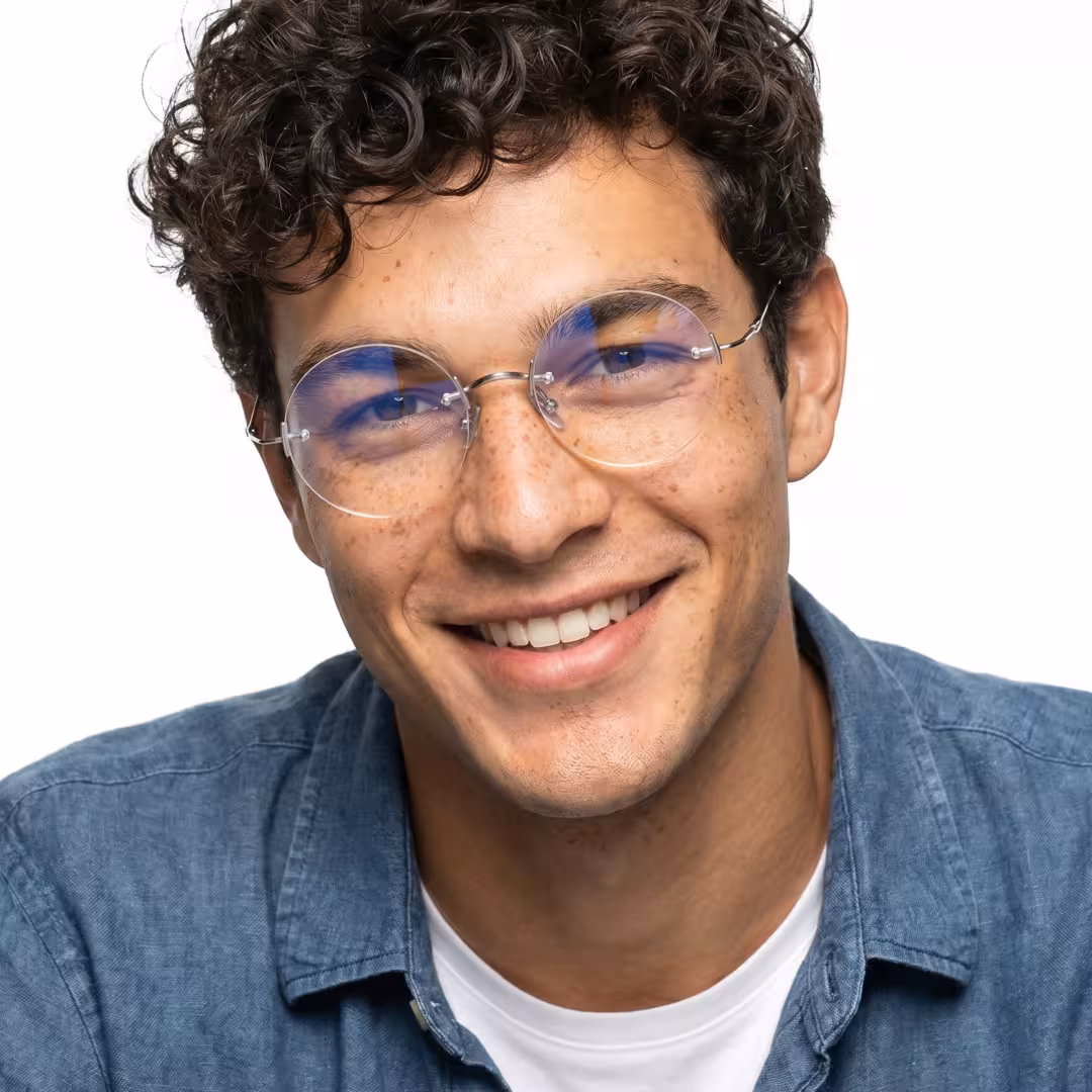 Front view of male wearing steampunk silver round eyeglasses, smiling, RT0262604