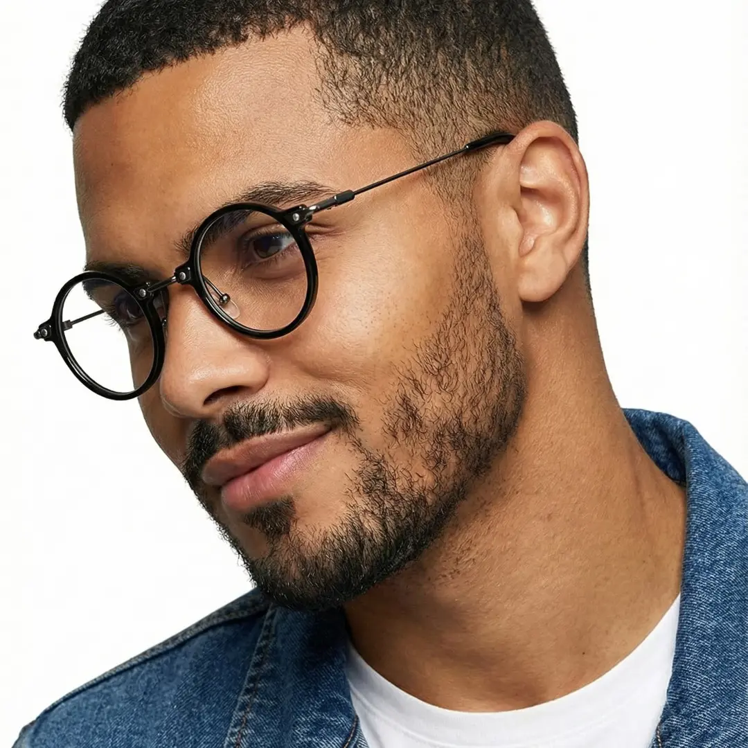 Profile view of male wearing steampunk black round eyeglasses, natural smile, RT0302405