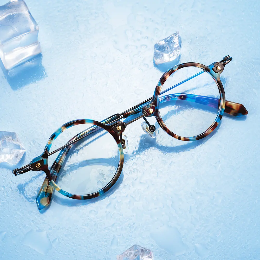 Scene close-up view of Vicky steampunk round titanium eyeglasses RT0302406 in blue tortoise