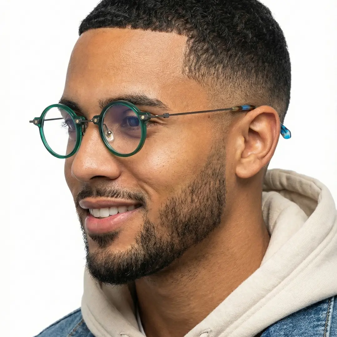 Three-quarter view of male wearing green round eyeglasses, neutral expression, RT0302406