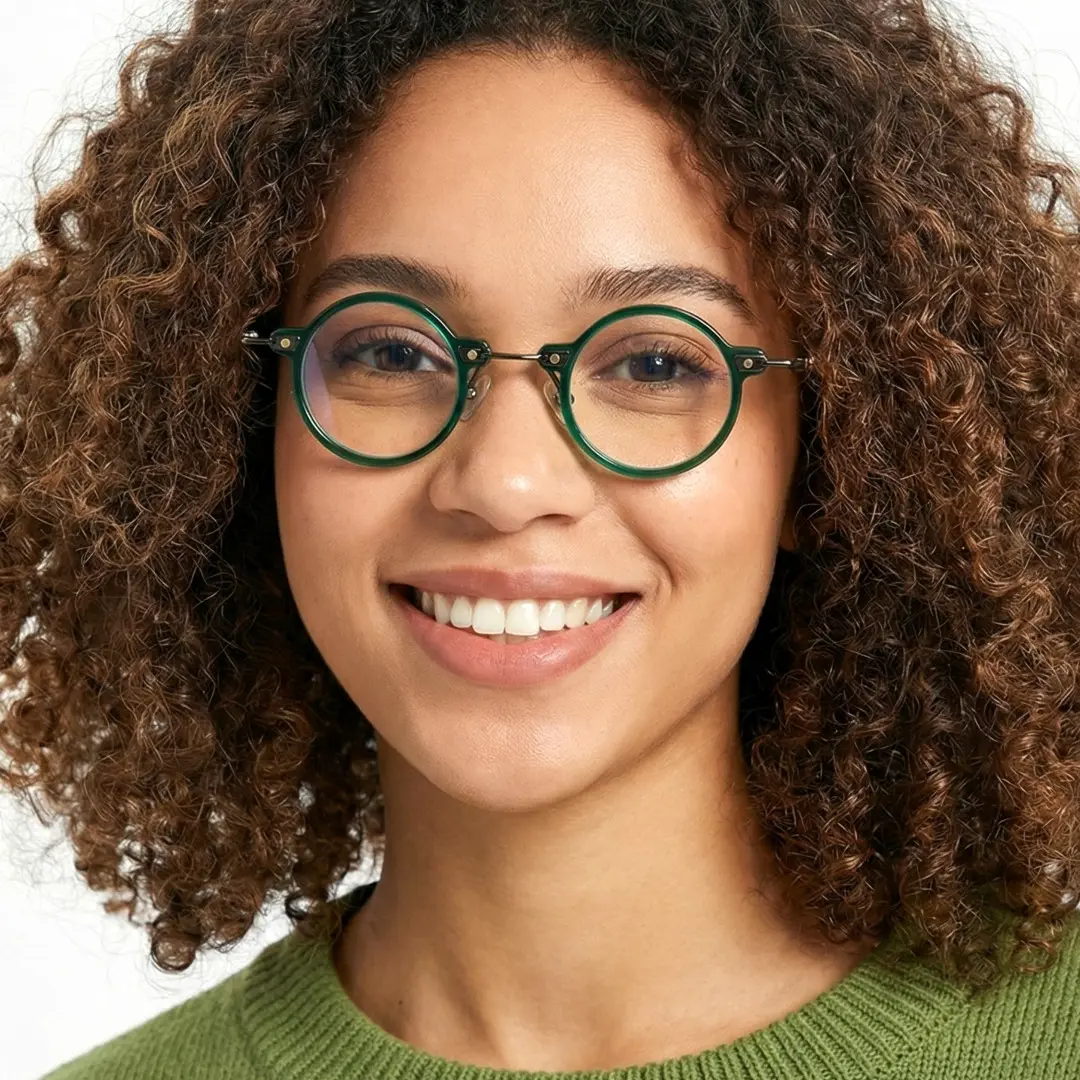 Front view of female wearing steampunk green round eyeglasses, smiling, RT0302406