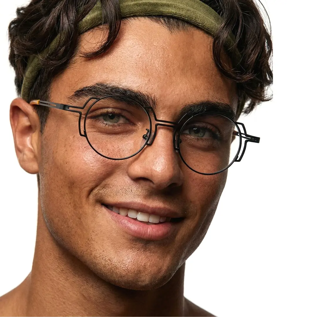 Front view of male wearing steampunk black round eyeglasses, natural smile, RT0522509