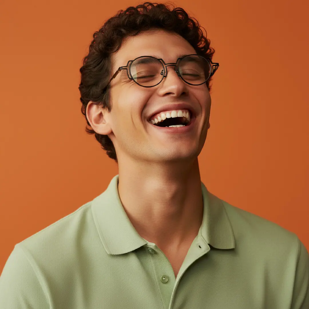 Front view of male wearing steampunk black round eyeglasses, smiling, RT0522509