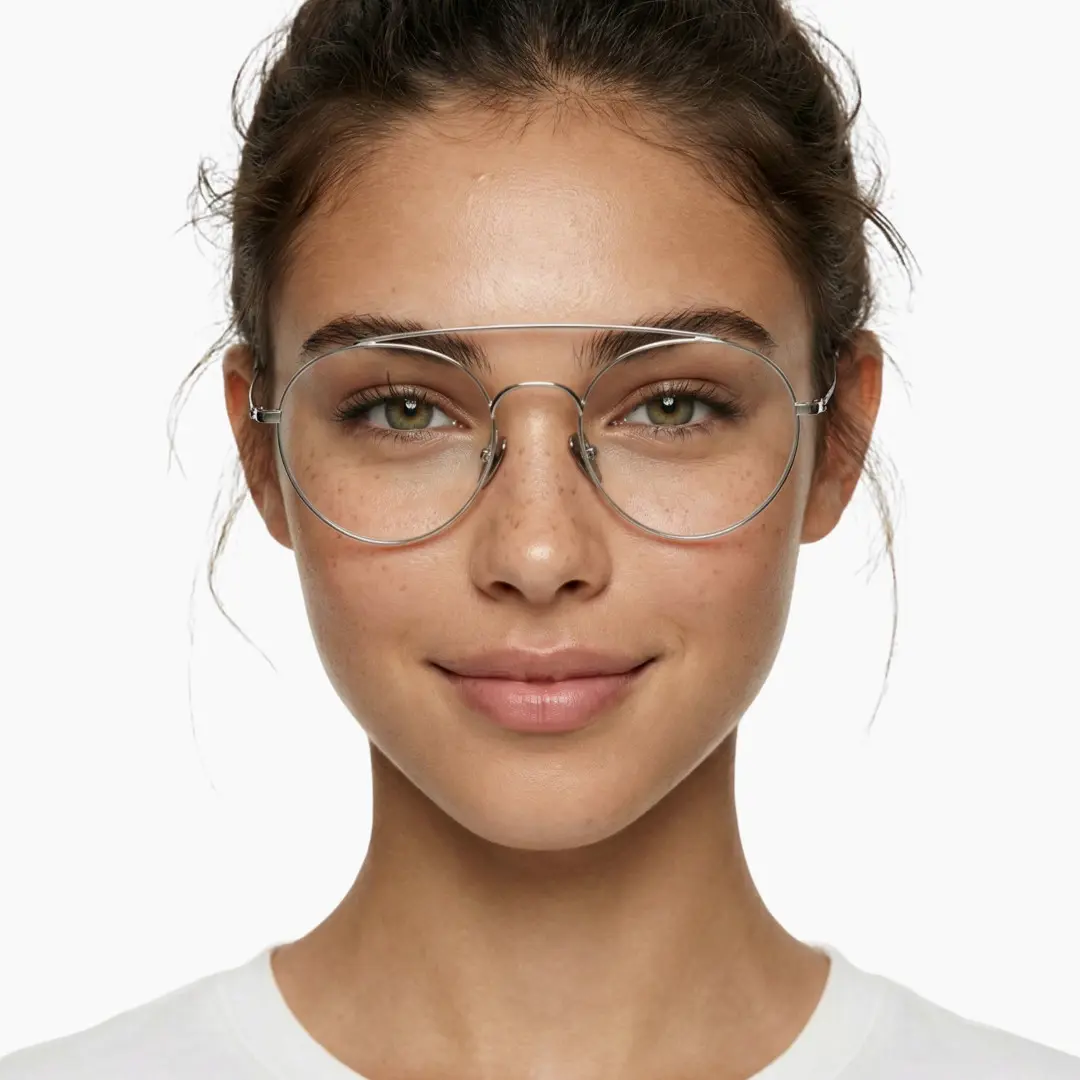 Front view of female wearing silver round eyeglasses, natural smile, RT0912508