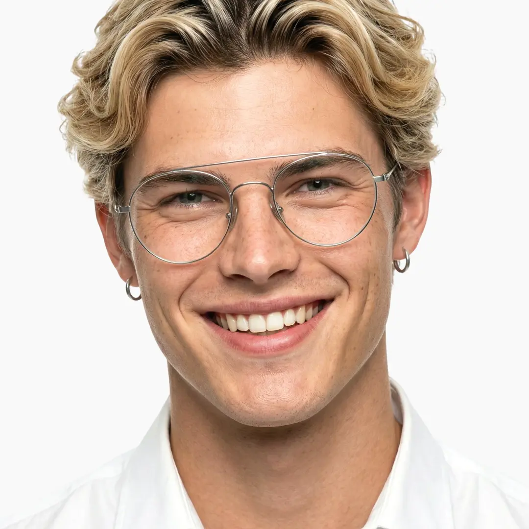 Front view of male wearing vintage silver round eyeglasses, smiling, RT0912508