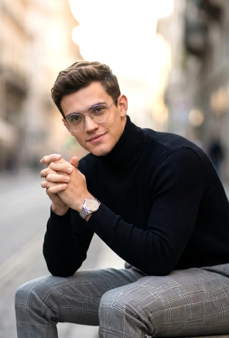 Male model wearing vintage silver round titanium eyeglasses in an outdoor urban street setting. SPU: RT0912508