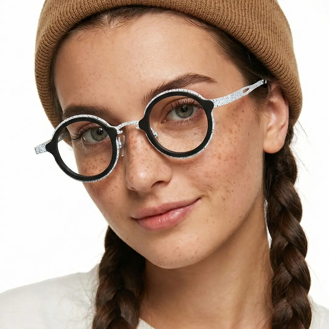 Three-quarter view of female wearing black round eyeglasses, smiling, RT0962508