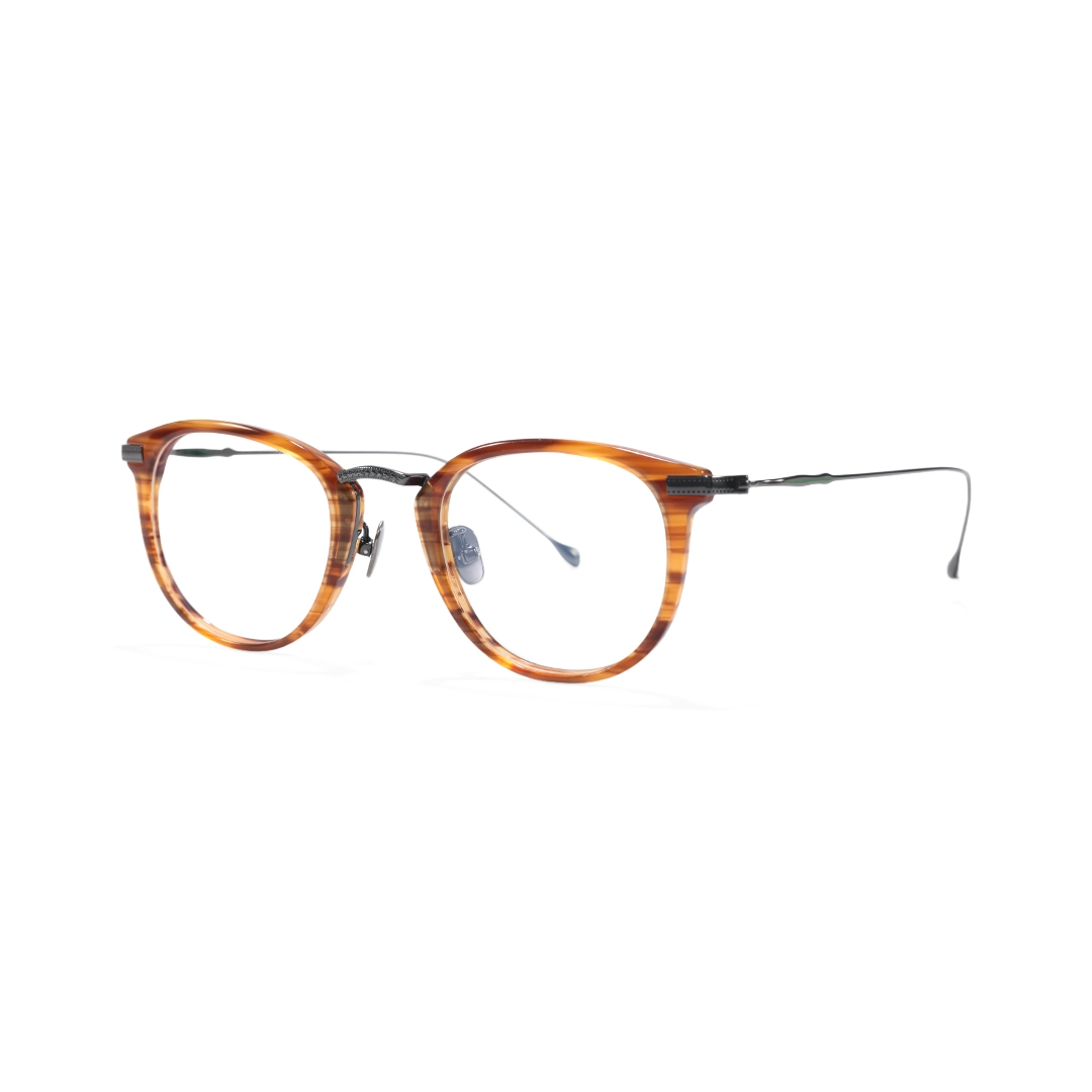 Angle view of Wilcox vintage round titanium eyeglasses RX0062207 in tortoise