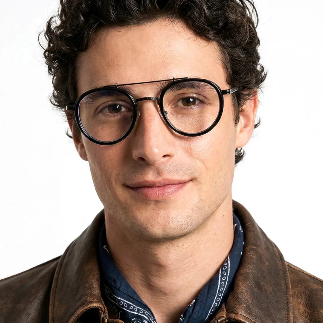 Front view of male wearing steampunk black round eyeglasses, smiling, RX0202509