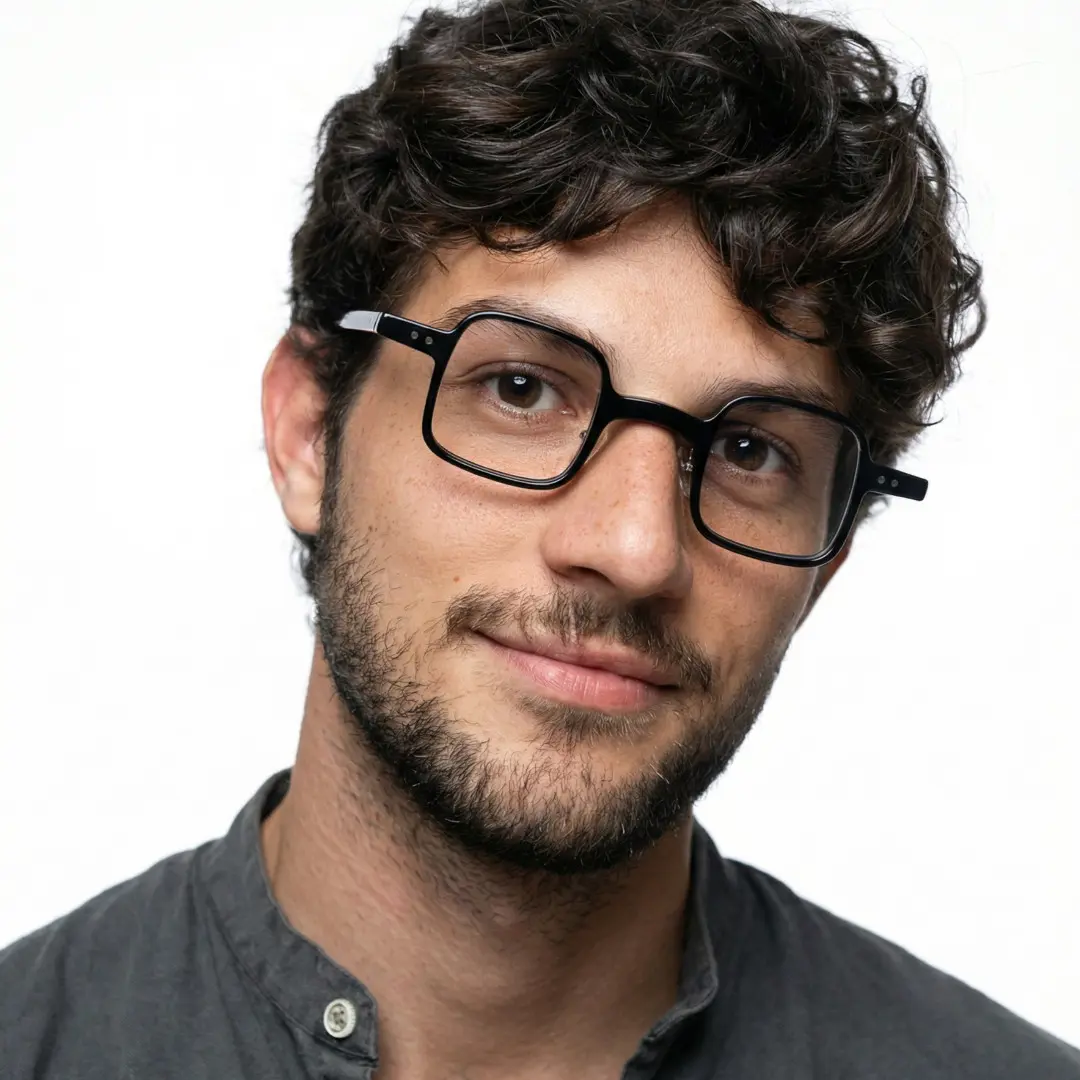 Tilted head view of male wearing vintage black square eyeglasses, friendly smile, SA0102302