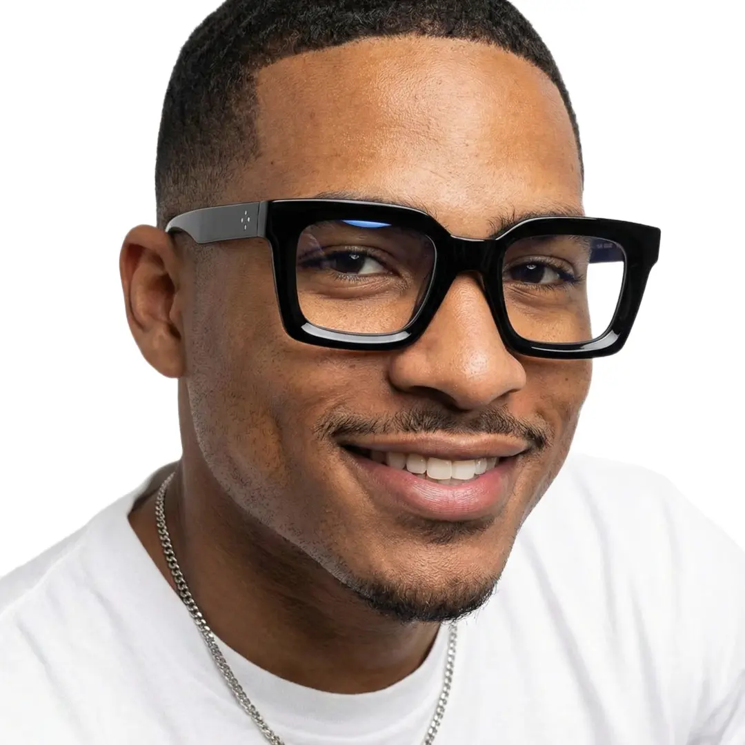 Three-quarter view of male wearing black square eyeglasses, friendly smile, SA0142406