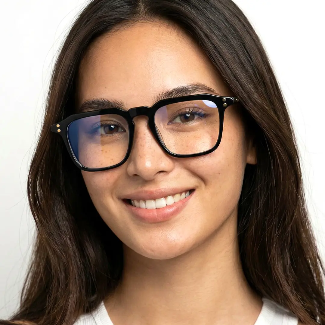 Front view of female wearing black square eyeglasses, smiling, SA0192403