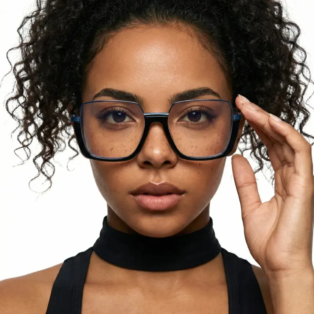 Front view of female wearing fashion black square eyeglasses, adjusting glasses, neutral expression, SA0382503
