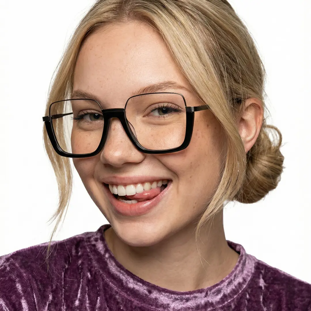Slightly angled view of female wearing fashion black square eyeglasses, sticking out tongue, smiling, SA0382503