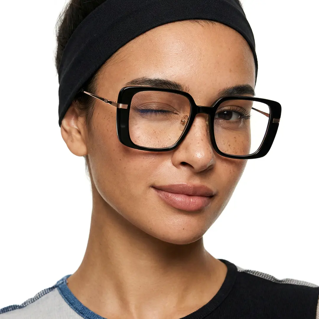 Slightly angled view of female wearing black square eyeglasses, winking, natural expression, SA0392503