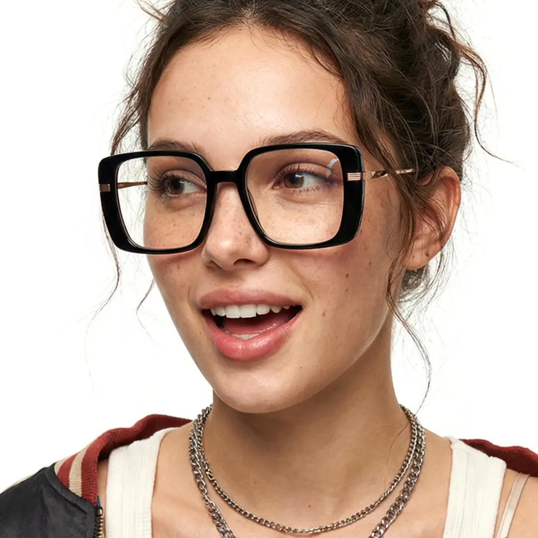 Three-quarter view of female wearing black square eyeglasses, open mouth, natural smile, SA0392503