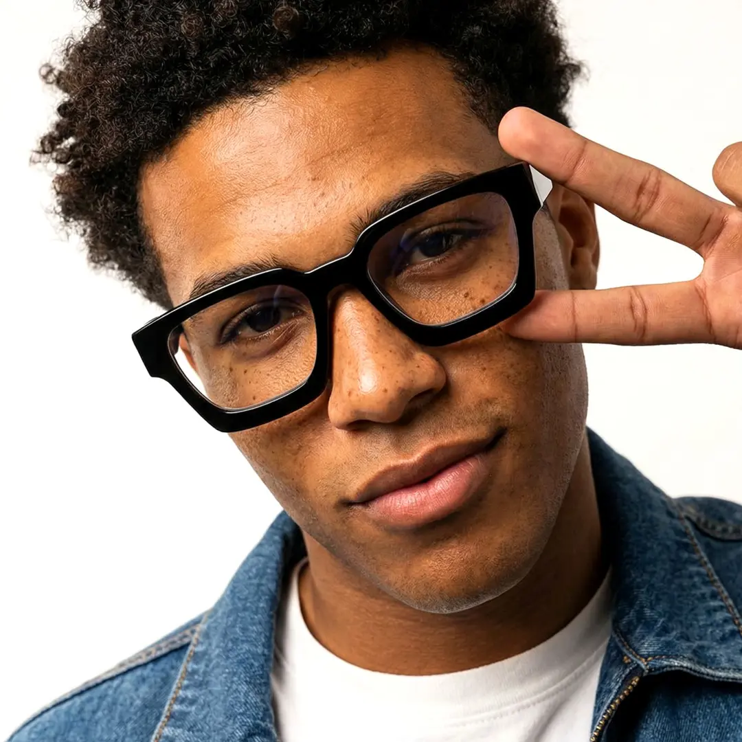Tilted head view of male wearing black square eyeglasses, neutral expression, SA0552302