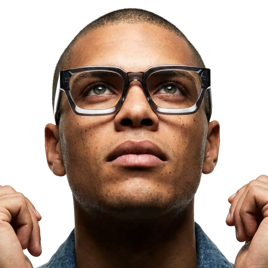 Looking away view of male wearing grey square eyeglasses, confident expression, SA0552302