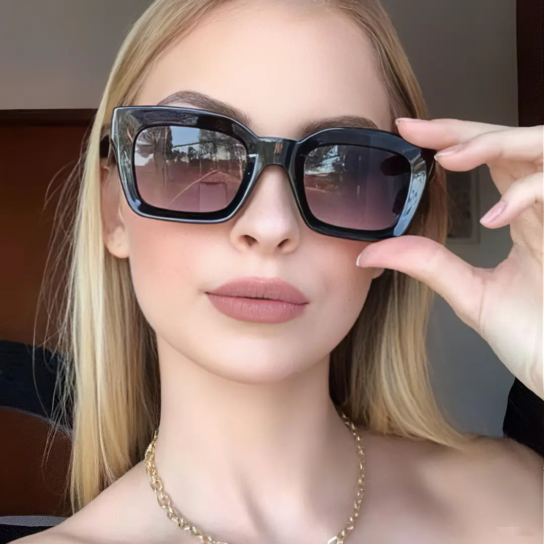 Front view of female wearing black square eyeglasses, holding glasses, natural expression, SA0602302