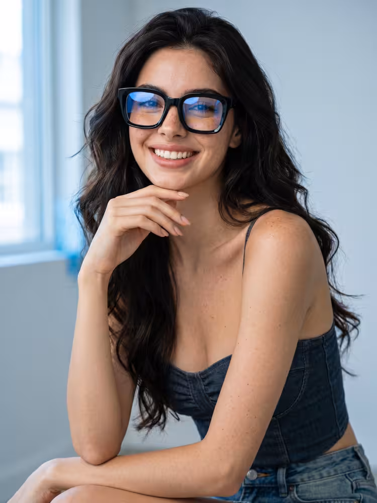 Female model wearing everyday black square acetate eyeglasses in a bright indoor setting. SPU: SA0602302