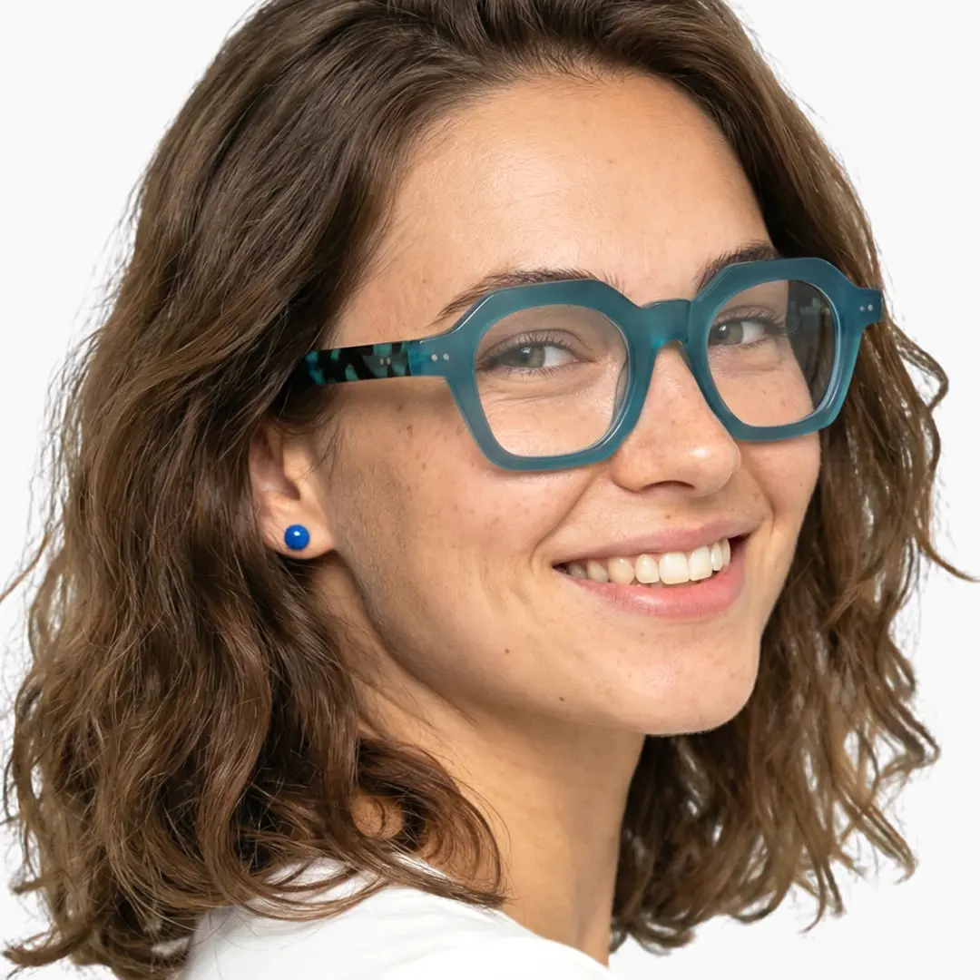 Over-the-shoulder view of female wearing light blue square eyeglasses, natural smile, SA0812302