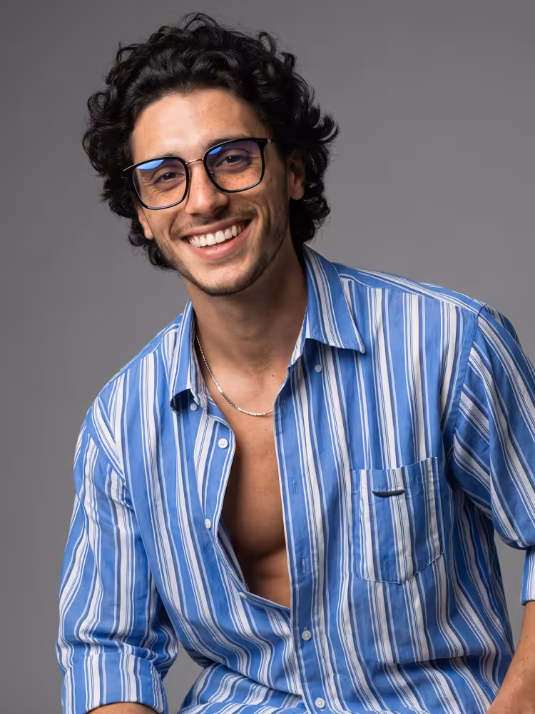 Male model wearing everyday black square metal eyeglasses in a clean studio setting. SPU: SM0102605