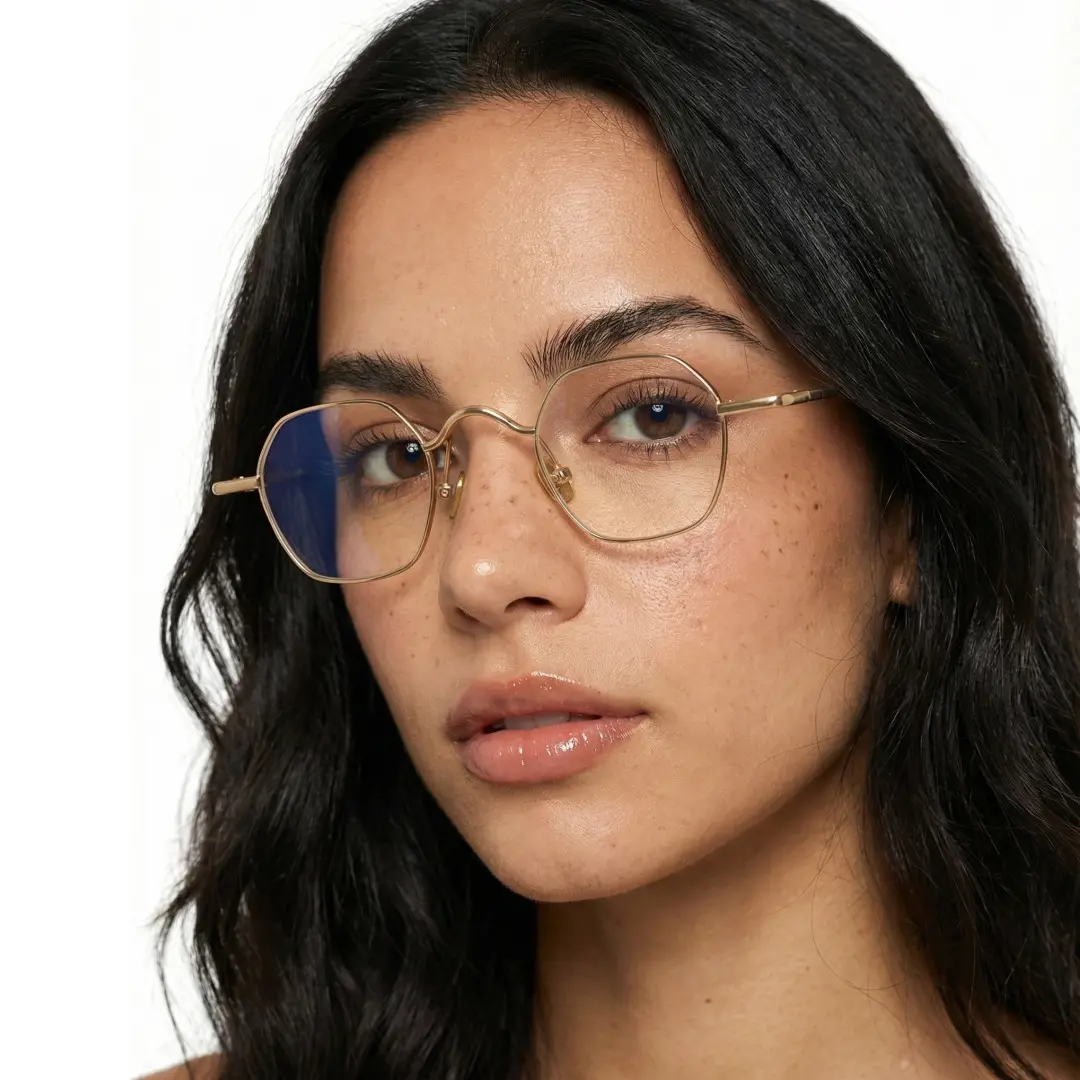 Face close-up view of female wearing gold square eyeglasses, relaxed expression, SM0192411