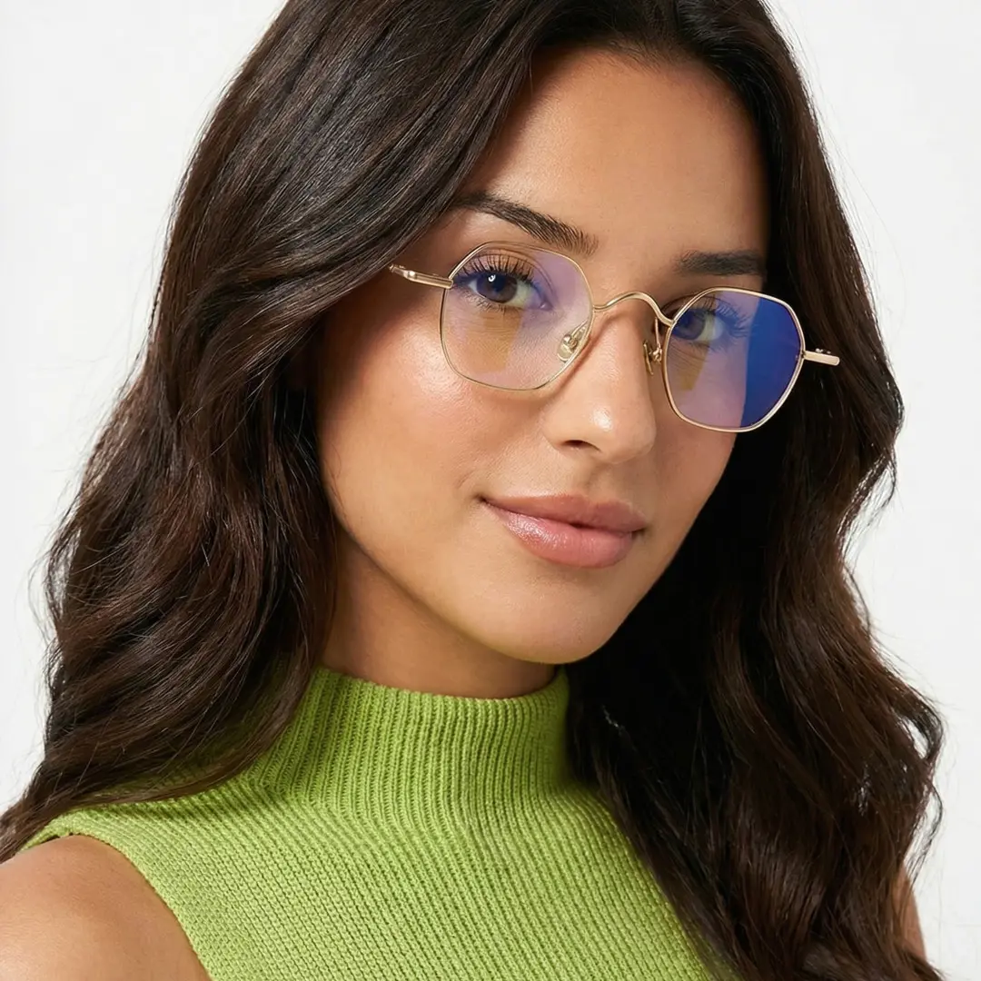 Front view of female wearing vintage gold square eyeglasses, tilting head, soft smile, SM0192411