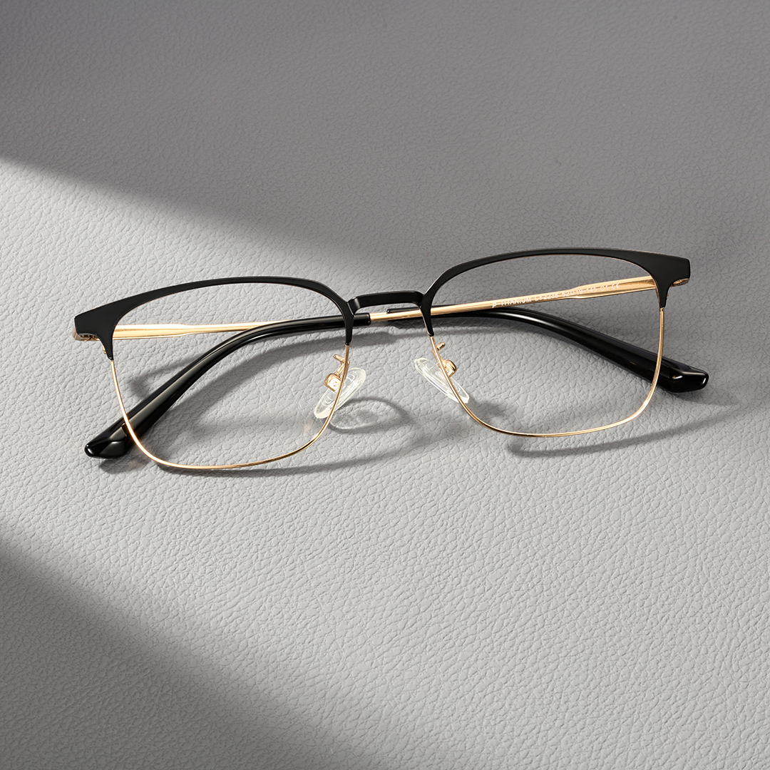 Front folded view of Sadie square metal eyeglasses SM0232409 in black & gold
