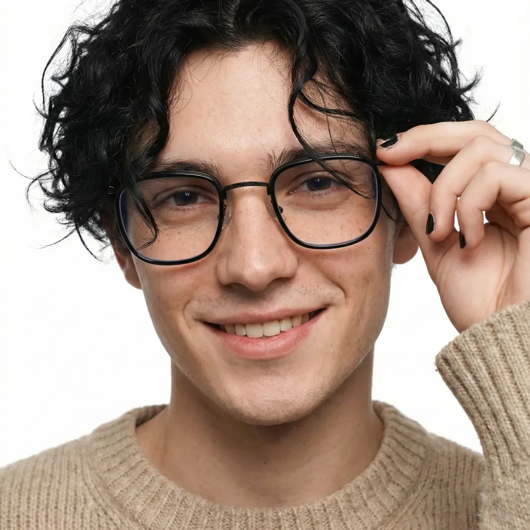 Front view of male wearing vintage black square eyeglasses, holding glasses, natural smile, SM0252302