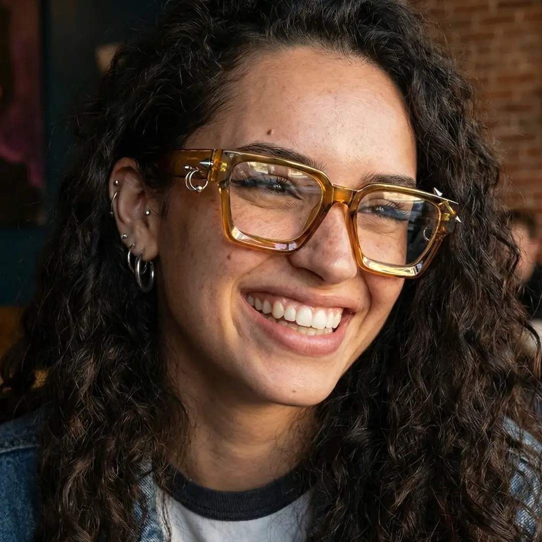 Front view of female wearing yellow square handcrafted polarized eyeglasses, big smile, SP0012511