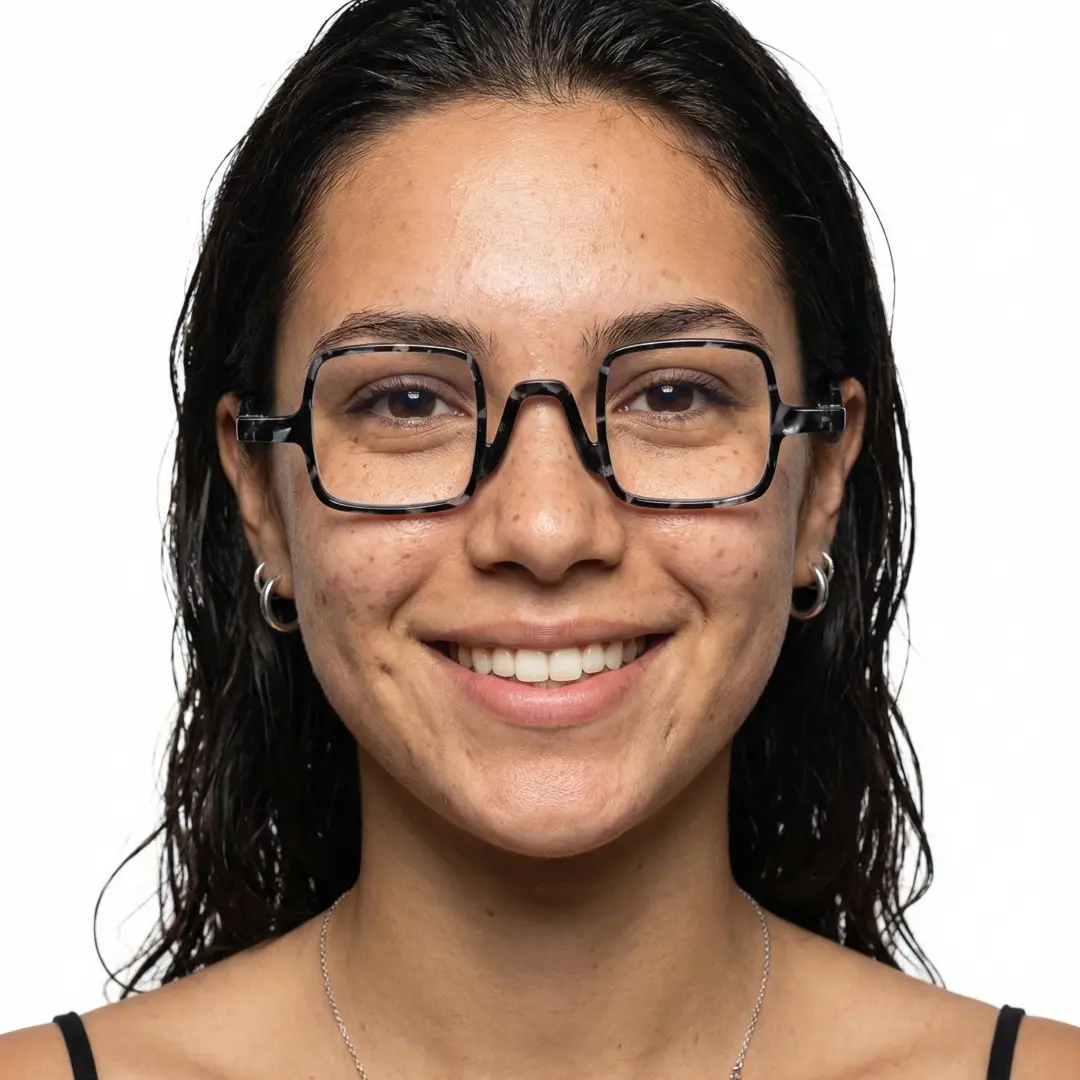 Front view of female wearing vintage black square eyeglasses, smiling, SP0022308