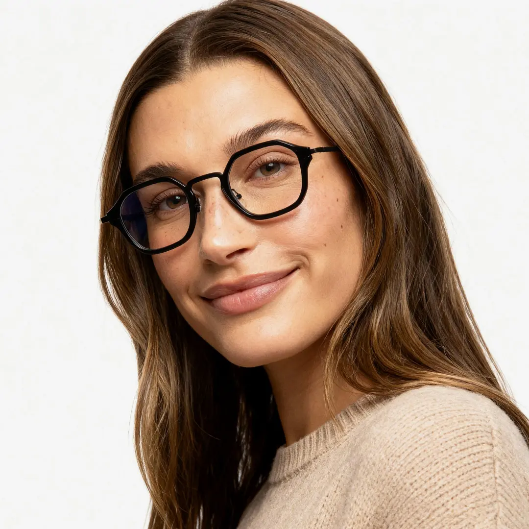 Looking straight ahead view of female wearing black square eyeglasses, soft smile, SP0042207