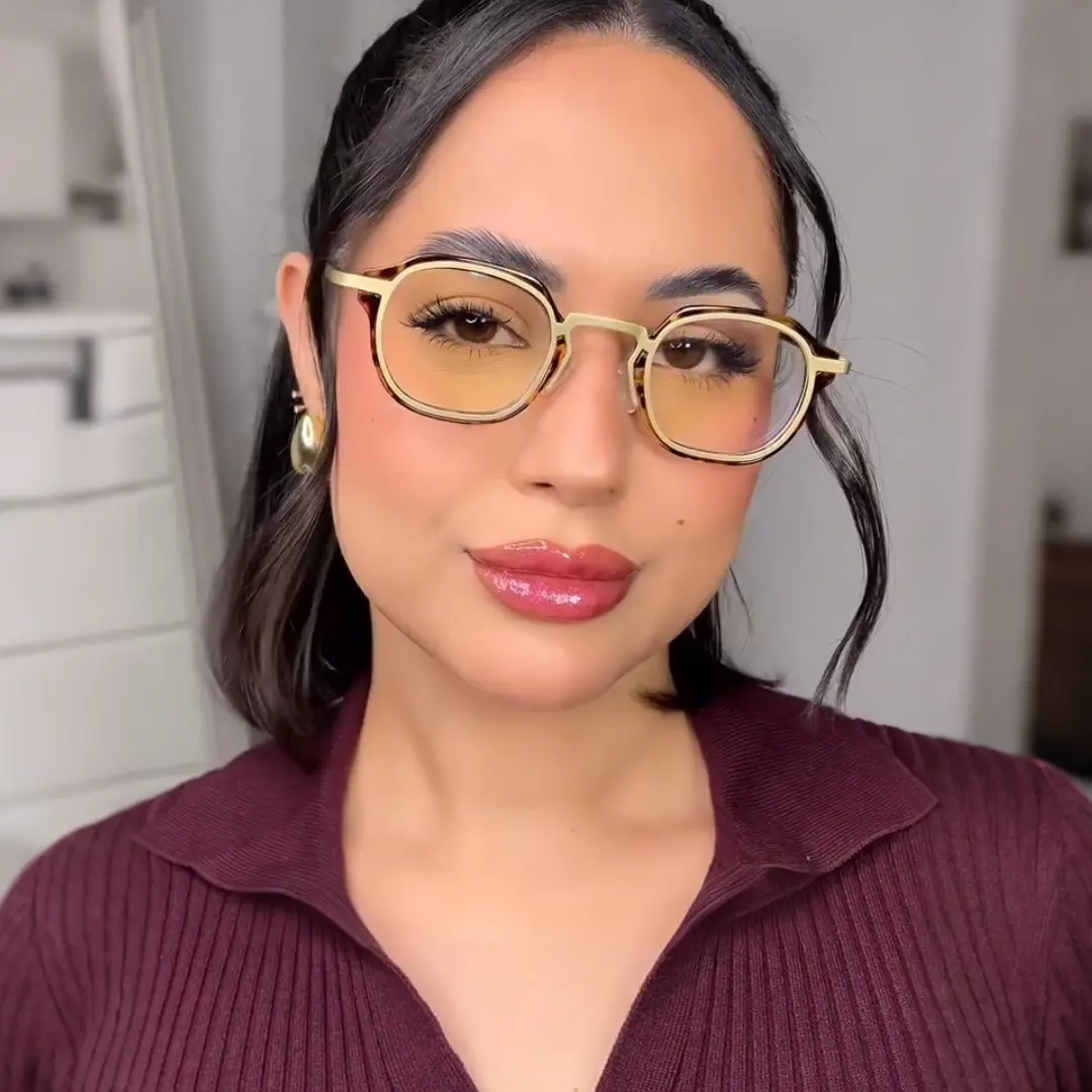 Front view of female wearing tortoise square eyeglasses, neutral expression, SP0042207