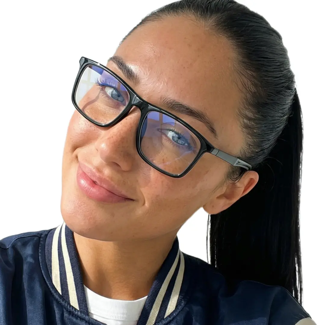 Tilted head view of female wearing black square eyeglasses, natural smile, SP0042503