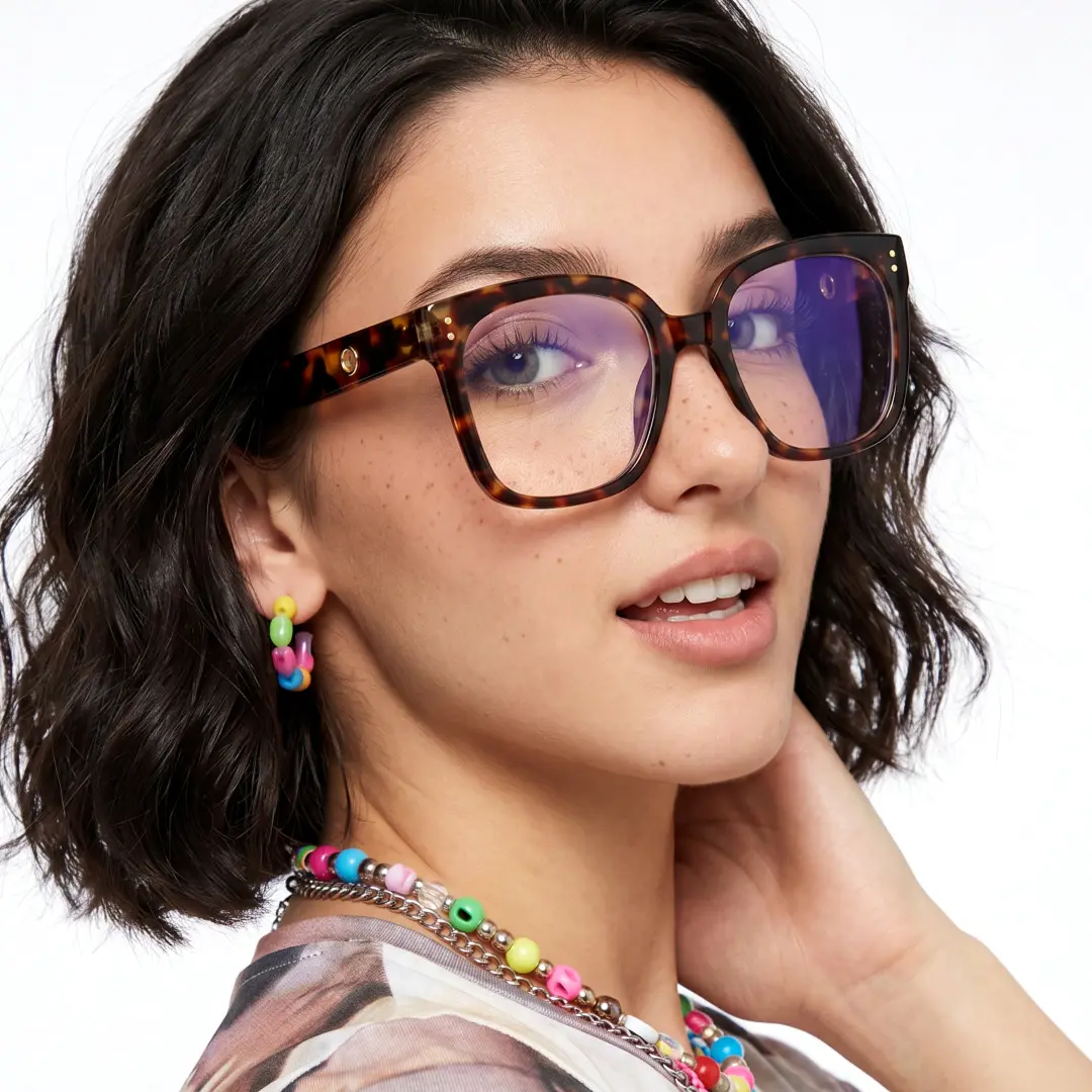Over-the-shoulder view of female wearing tortoise square eyeglasses, hand touching neck, natural smile, SP0062508