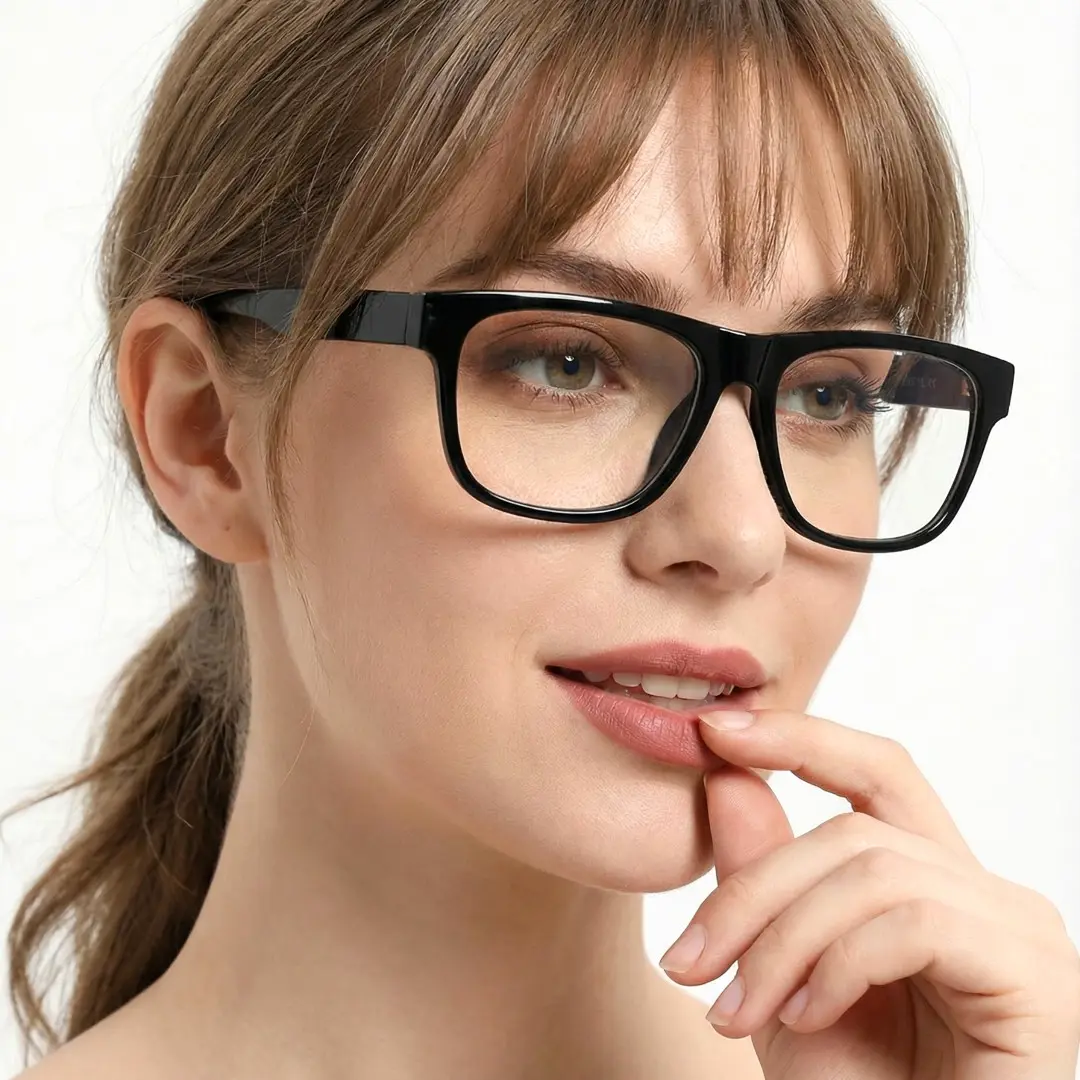 Three-quarter view of female wearing black rectangle eyeglasses, soft smile, SP0072209