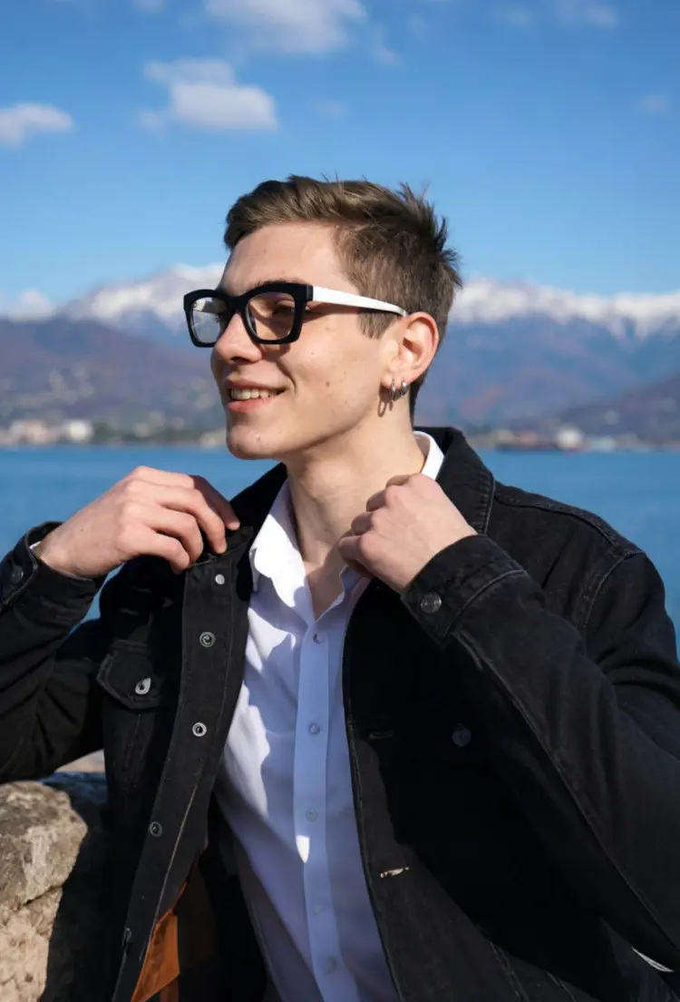 Male model wearing everyday glasses beige square pc eyeglasses at a lakeside with mountain views. SPU: SP0082408