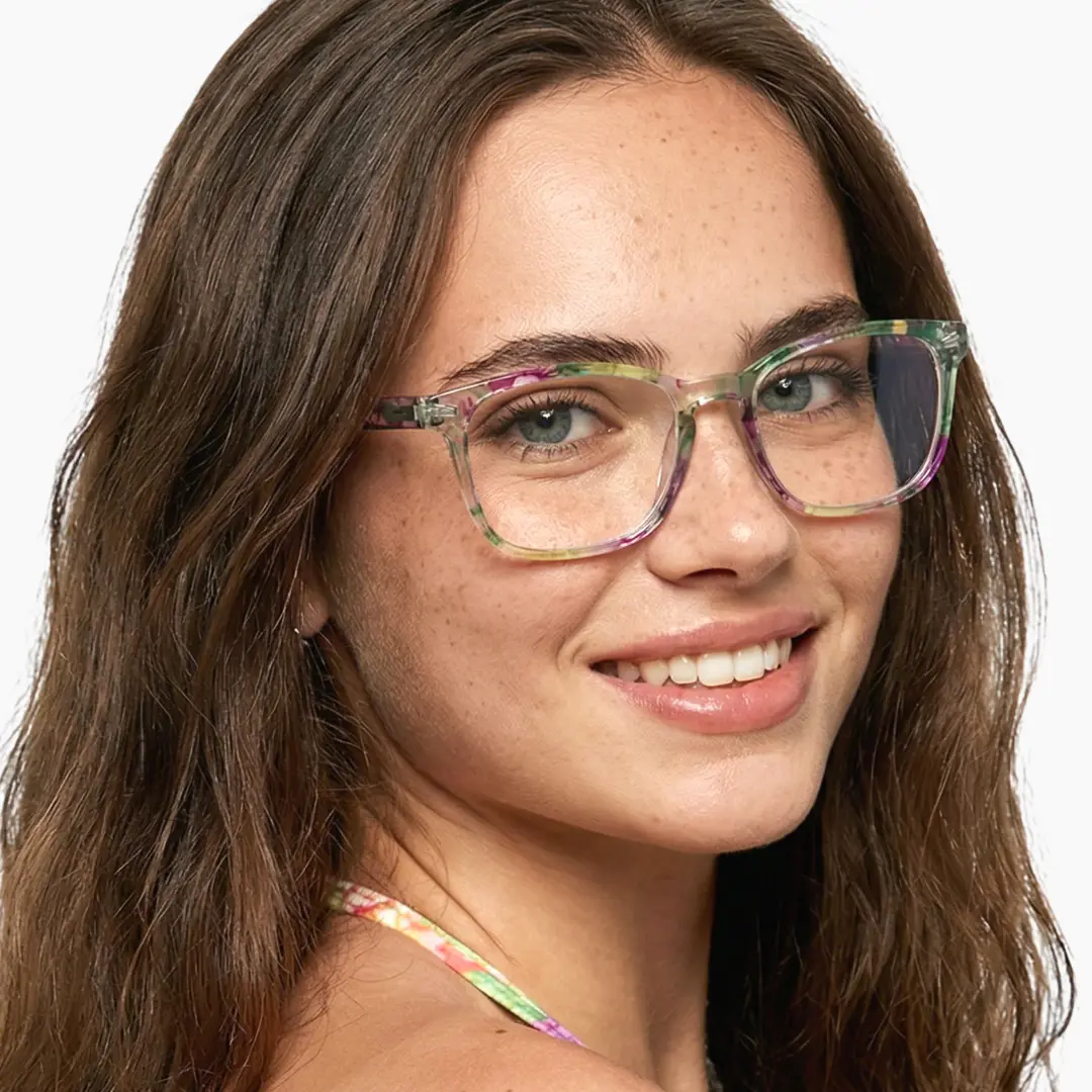 Over-the-shoulder view of female wearing colorful green square eyeglasses, smiling, SP0112308